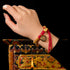 Auspiciousness, prosperity, coiled hand rope, zakiram pendant