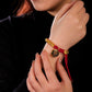 Auspiciousness, prosperity, coiled hand rope, zakiram pendant