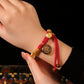 Auspiciousness, prosperity, coiled hand rope, zakiram pendant