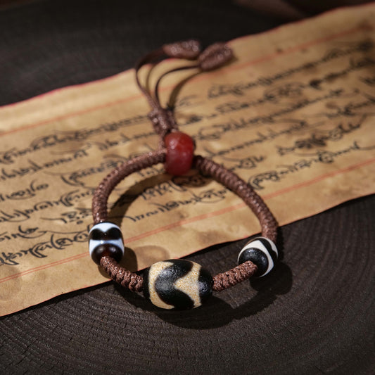 Auspicious to ward off evil hand-woven tiger tooth dzi bead bracelet