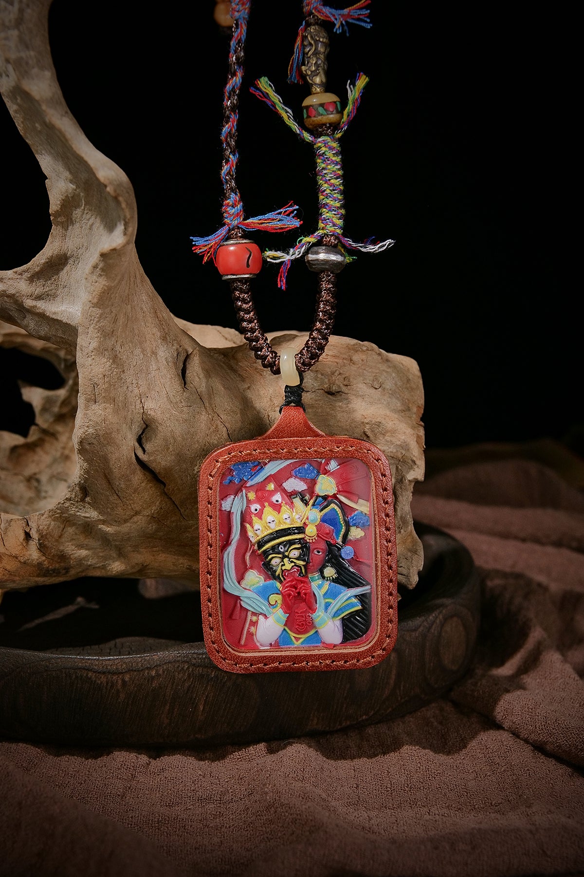 Inviting wealth and blessing peace, hand-stitched leather, vermillion painted zakiram thangka