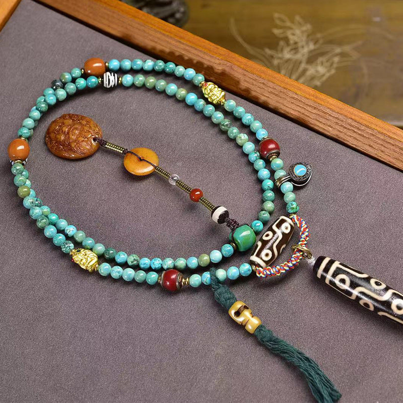 Tibetan Turquoise Mala Necklace with Camel Bone and Nine-Eyed Dzi Bead